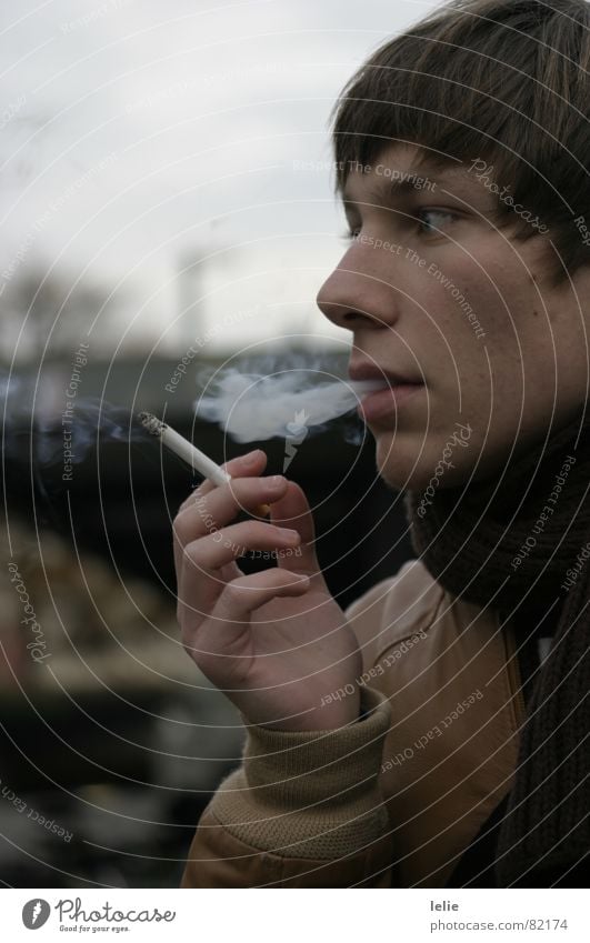 cigarette. Cigarette Posture Cold Autumn Man Gray Brown Scarf Jacket Hand Smoke Human being Train station Hair and hairstyles Nose Face Looking industrial world