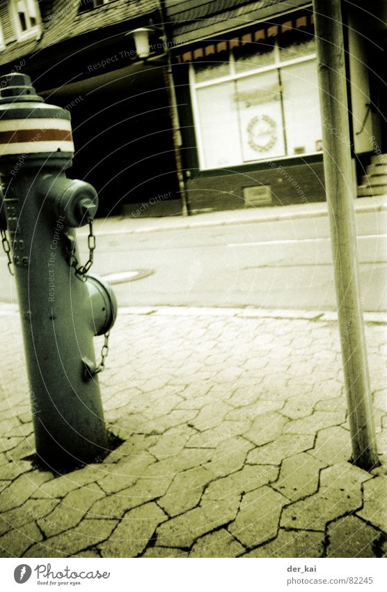 ghost town Fire hydrant Ghost town Shop window Town 1999 Lomography Traffic infrastructure humbug Street Sepia Cobblestones