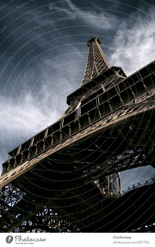 No fear of heights Paris Clouds Steel Landmark Art Dark Exciting Alarming Eerie Moody Tourist Tourism Worm's-eye view Night Eiffel Tower Flair Threat Creepy