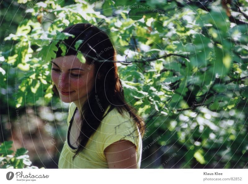 to smile with happiness Shame Tree Forest Summer Woman unschaft Laughter Twig yellow shirt