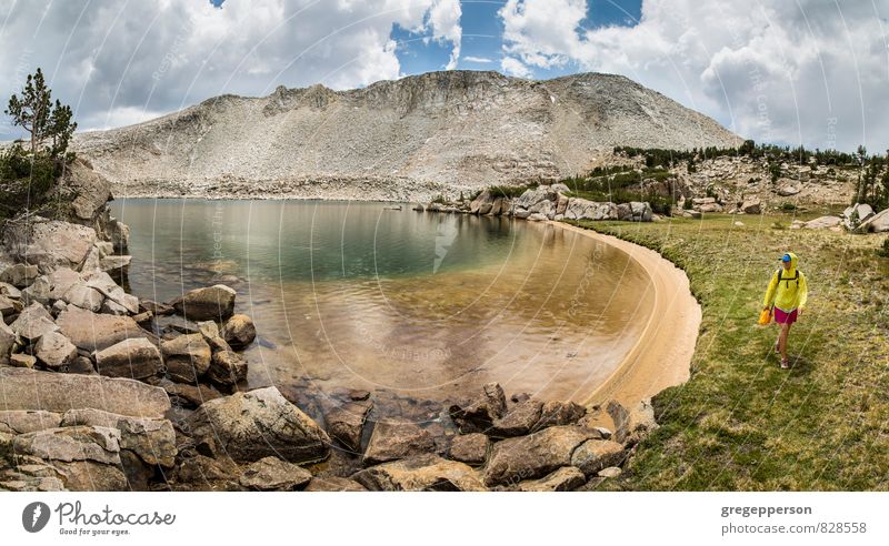 Hiker in the Yosemite wilderness. Adventure Mountain Hiking Climbing Mountaineering Woman Adults Clouds Lake Running Self-confident Determination achievement