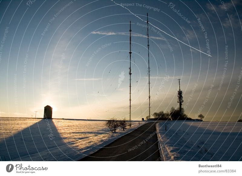 Transmission masts Dillberg and Trafohäuschen Broadcasting tower Sunset Back-light Airplane Vapor trail Bushes Darken Passenger plane Approach road Evening