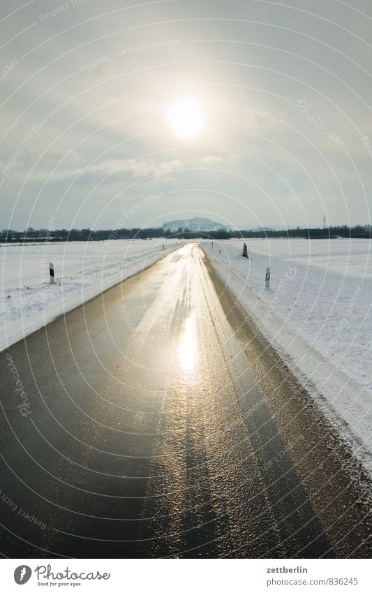 gradeau Landscape Snow Winter Winter maintenance program Winter vacation Snowscape Asphalt Street Line Direct Right ahead Target Horizon Sun Back-light