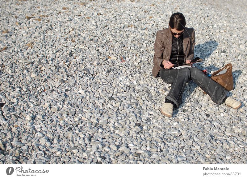 Beach life in winter Knock-kneed Liguria Pebble beach Reading Winter winter beach sunny day