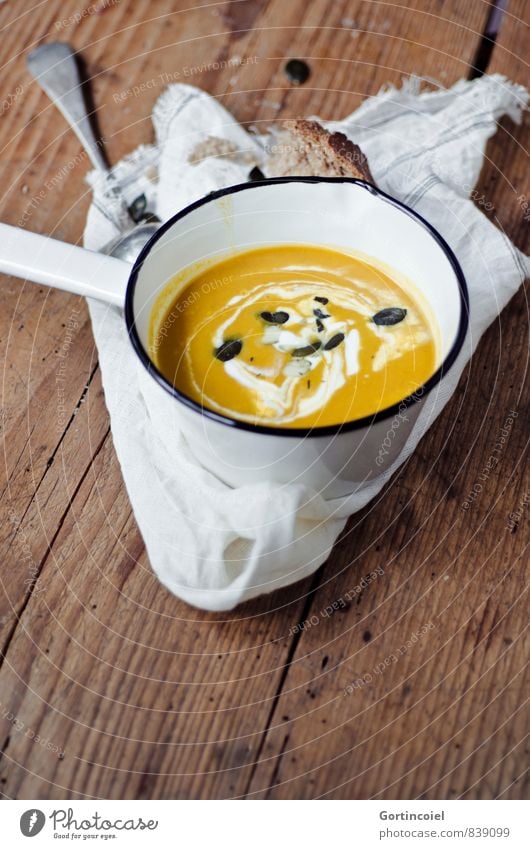 pumpkin soup Food Bread Soup Stew Nutrition Lunch Vegetarian diet Slow food Pot Autumn Delicious Orange Wooden table Food photograph Autumnal Pumpkin soup