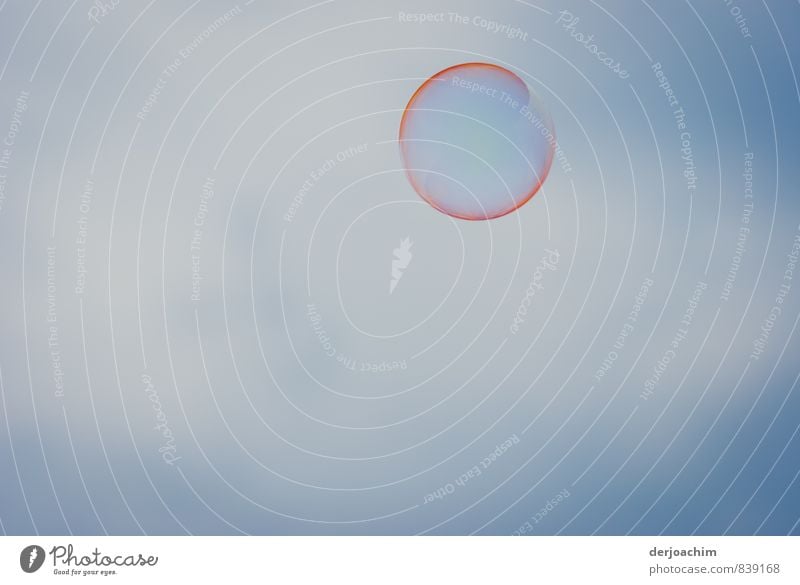 A soap bubble in a blue sky with a red border. Floating freely Well-being Contentment Senses Relaxation Calm Adventure Playing Environment Nature Water Summer