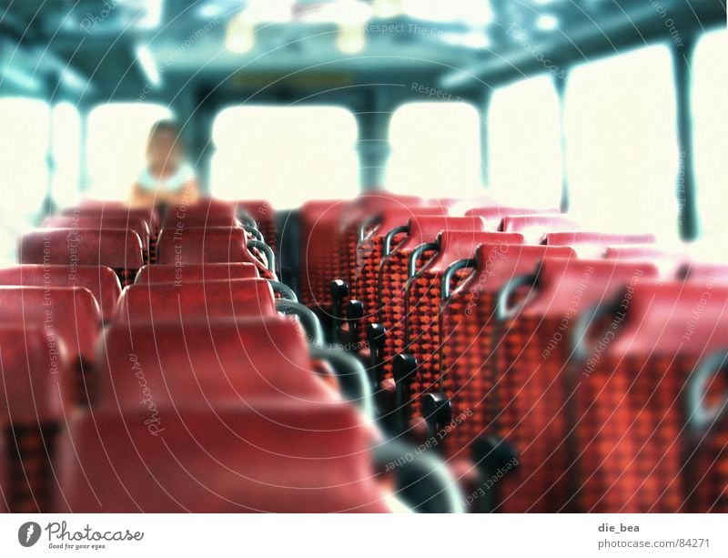 Place in the bus Firm Blur Row of seats Red Light Free space Rear seat Shaft of light Bus Seating Transport seat reservation Human being