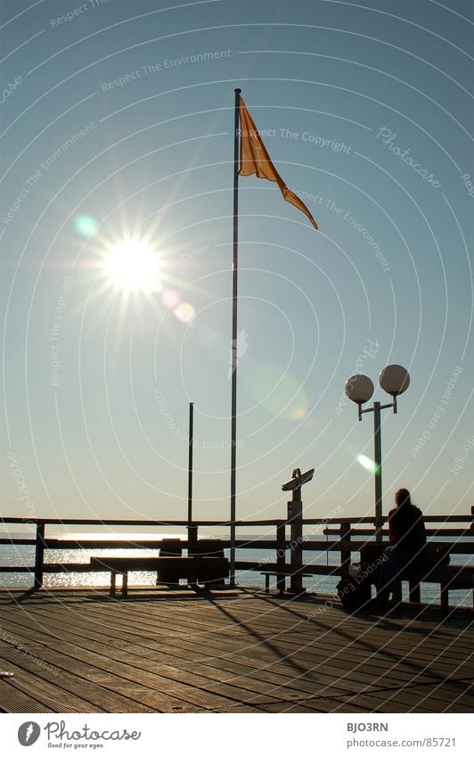 the eighth note aka. spot landing (now in color) Lake Tilt-Shift Jetty Flag Rod Lantern Portrait format Footbridge Plank Radiation Dazzle Ocean Binoculars