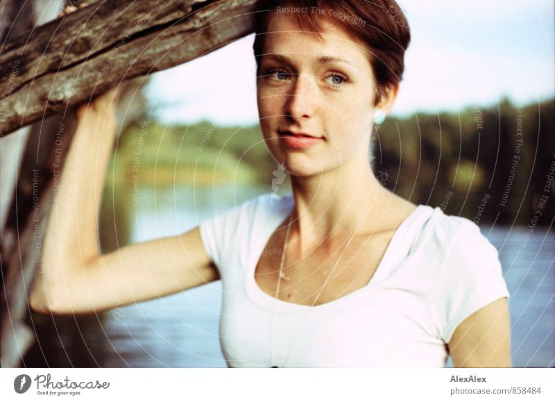 slender, young woman with freckles stands by a tree in a bathing lake at Uder Trip Young woman Youth (Young adults) Face Freckles 18 - 30 years Adults Nature