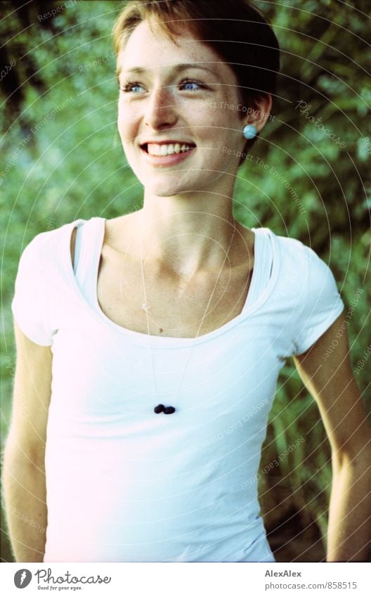 Portrait of a young, slender, beautiful woman smiling on a summer evening Trip Summer Young woman Youth (Young adults) Freckles 18 - 30 years Adults Bushes