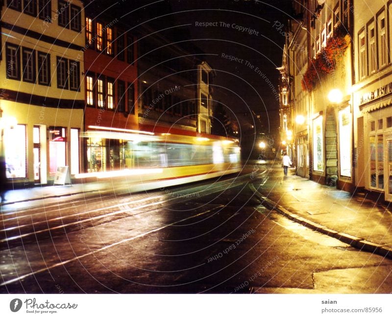 city impressions Tram Night Light Impression Long exposure Vanishing point House (Residential Structure) Lantern Traffic infrastructure Street Colour