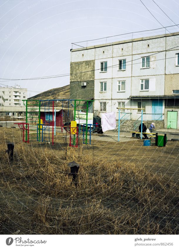 Doc #playground Human being Senior citizen Group Small Town Downtown Playground Building Sit Gloomy Crisis Colour photo Exterior shot Copy Space top