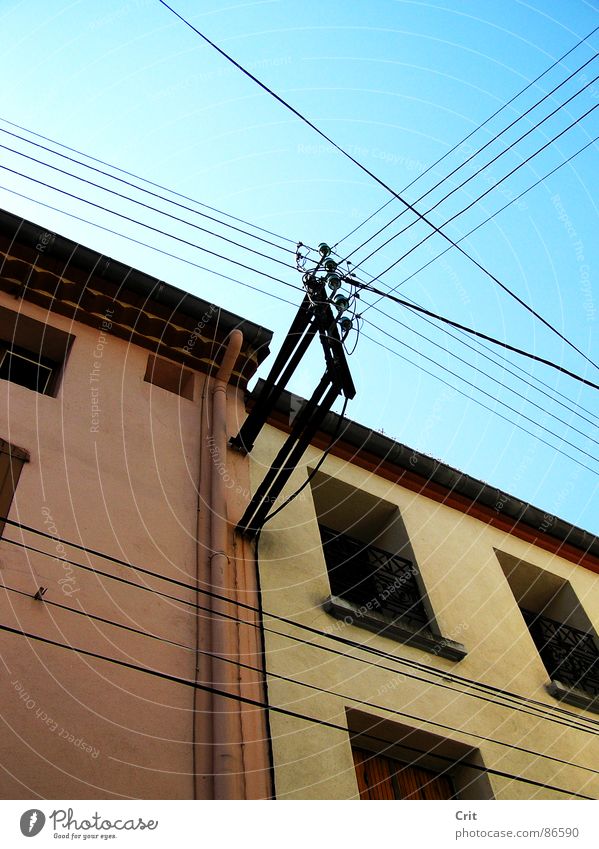 House with electric wires Sky Power France Electric lines window building