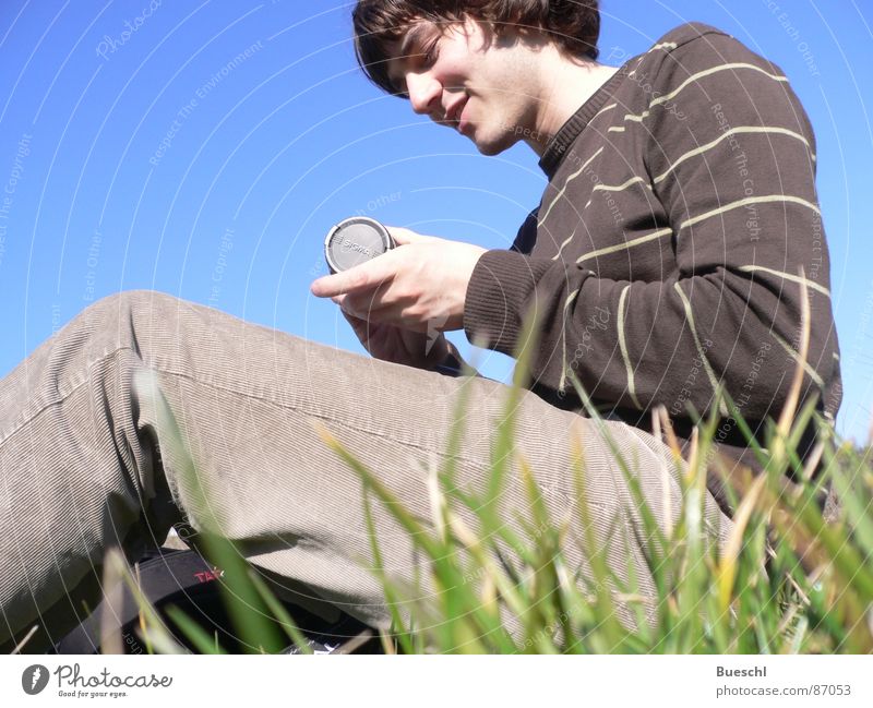 On grass Grass Masculine Worm's-eye view Meadow Green Grass surface Objective Sit Sky Human being