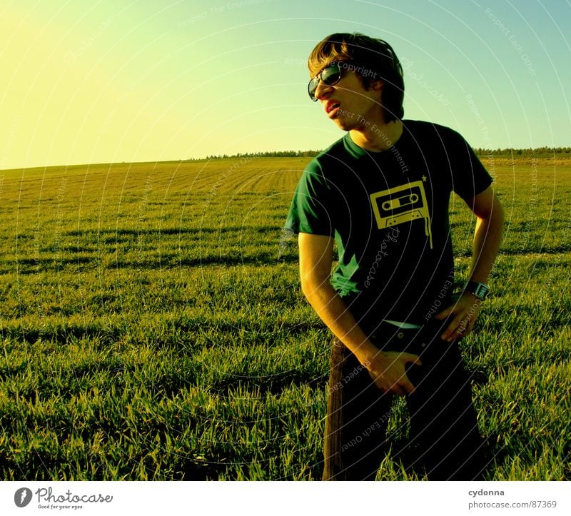 EI-CATCHER I Meadow Grass Green Style Sunset Posture Blade of grass Tape cassette Sunglasses Pornography Behavior Emotions Human being Joy Nature Landscape