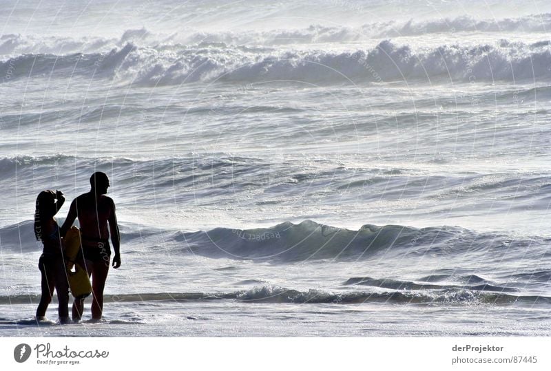 Baywatch without victim Ocean Waves Stand Surf Woman Portugal September Water knee-deep Swimming & Bathing Couple Idyll In pairs