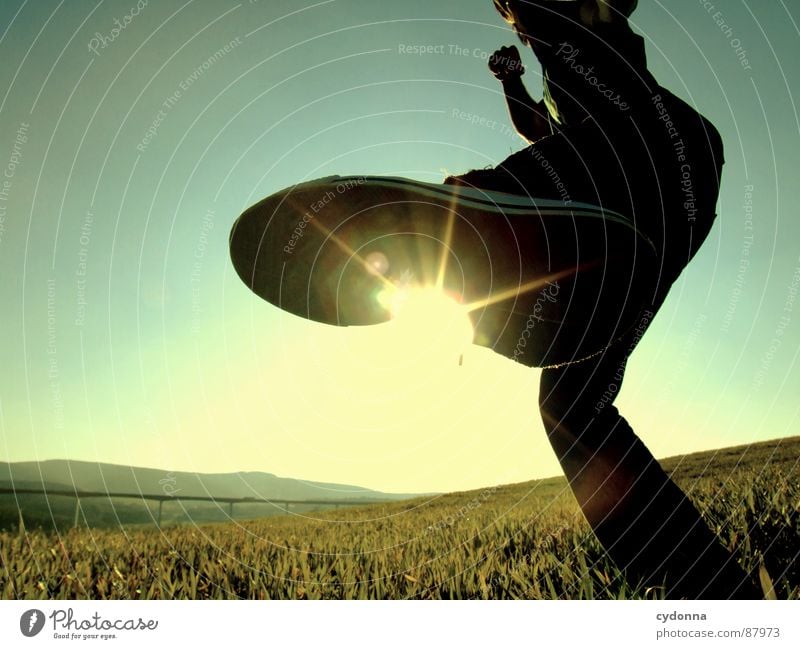 KICK IT BACK Footstep Illuminate Meadow Grass Green Style Sunset Posture Blade of grass Sunglasses Sunlight Kick Chucks Worm's-eye view Emotions Human being Sky