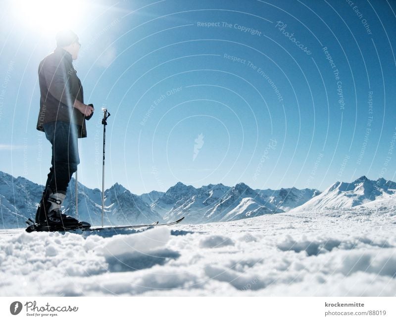 At the peak of anticipation Ski pole Ready to start Mountain range Engadine Switzerland Skiing Winter sports Snow layer Sunbeam Alpine Back-light Skier