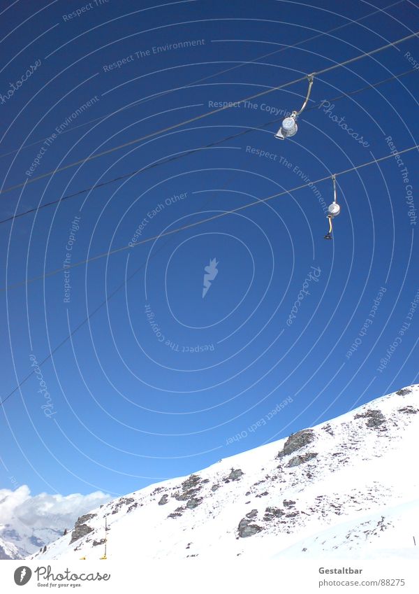 It's going uphill Winter Cold Ski run Red Black Switzerland Mountain Playing Snow plate lift Alps Blue 4 Vallées Ski tow Ski lift 2 Blue sky Cloudless sky