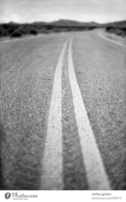 on the road Dry Nevada Asphalt Tar Security cordon Center line Blur Far-off places Hot Physics Loneliness Truck Main street Transport Horizon USA Desert Street