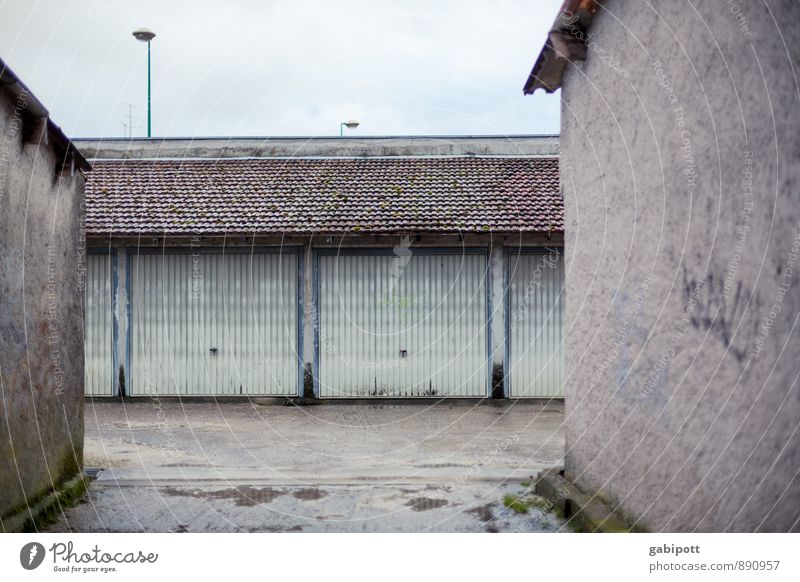 alternative to parking tickets Town House (Residential Structure) Garage Backyard Wall (barrier) Wall (building) Trashy Gloomy Gray Boredom Mobility Rainwater