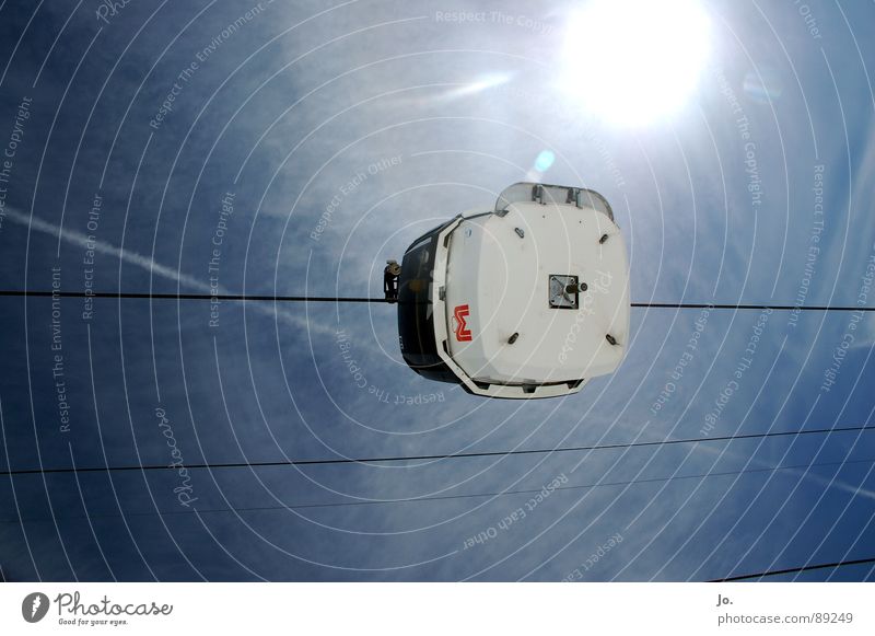 End Station Sun Blue Worm's-eye view Upward Horizontal Back-light Sunlight Sunbeam Gondola Bright background Copy Space top Steel cable Skyward