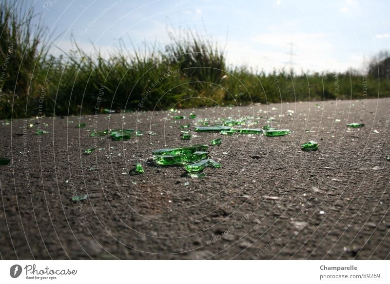 Bicycle path with obstacle Bottle of beer Cycle path Green Grass Asphalt Anger Aggravation Derelict Alcoholic drinks Lanes & trails Glass Street Nature Dirty