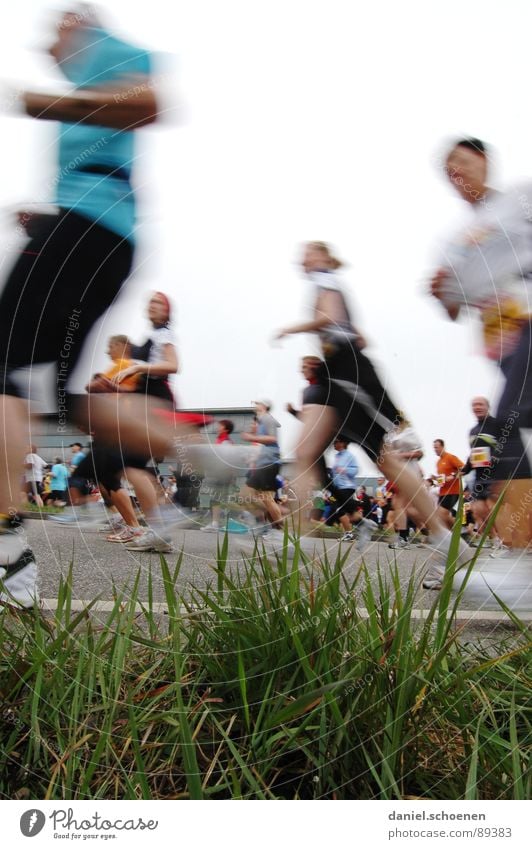 running people from the point of view of a worm Jogging Speed Footwear Sneakers Endurance Grass Motion blur Group Fitness Walking Running Movement Legs Healthy