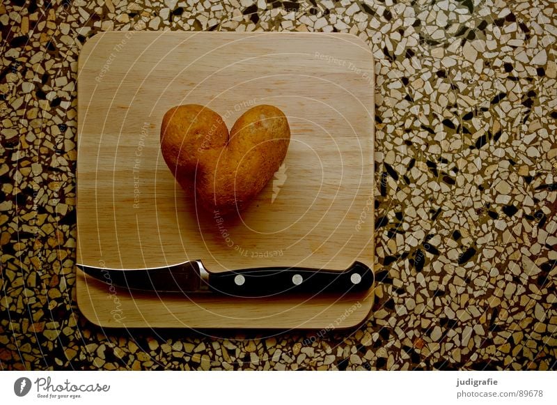 heartache Colour photo Interior shot Day Food Nutrition Vegetarian diet Knives Kitchen Heart Love Dark Kitsch Lovesickness End Cooking Chopping board Bulb Cut