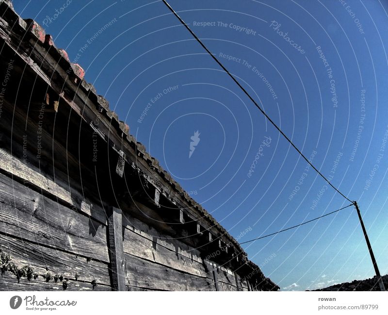 sheds Shed Wooden house Cable Electricity pylon Grayed Wall (building) Derelict Transience Barn Americas Old Warmth Hut salt reservoir Blue sky Worm's-eye view