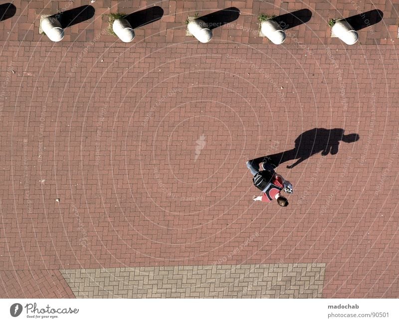 YOU NEVER WALK ALONE Human being Fellow Man Masculine Going Summer Bollard Shadow Midday Asphalt Backpack University & College student Bird's-eye view