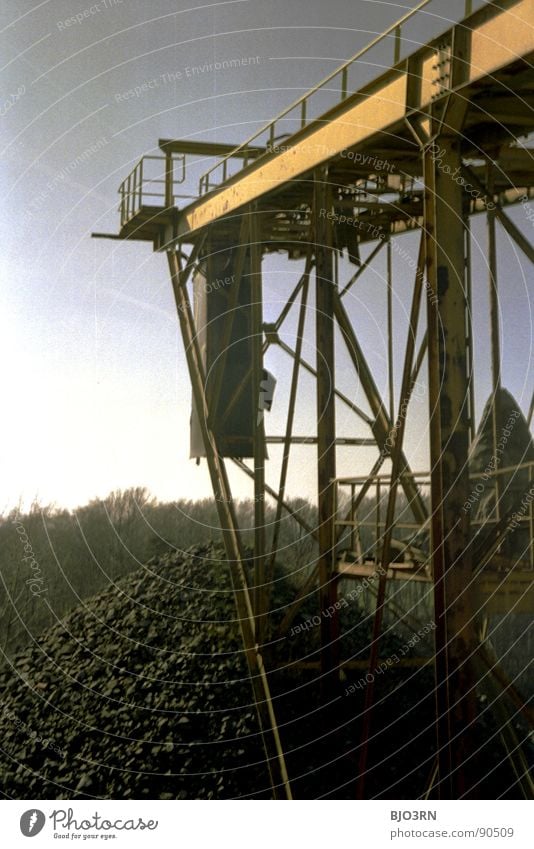 Stone Age Pile of stones Stony Analog Portrait format Vertical Vantage point Conveyor belt Aspire Sun Gray Forest Tree Industry stone mountain Edgewise Mountain