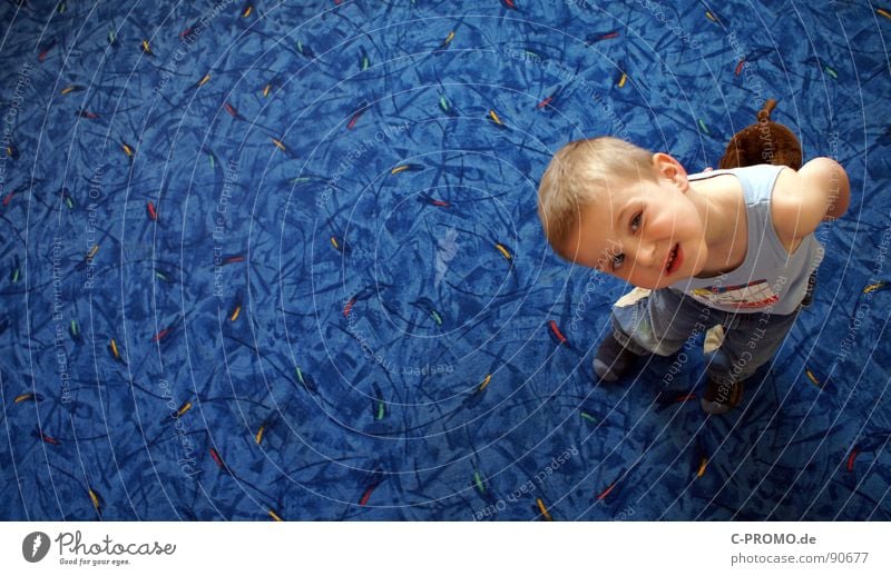 Boy looks up skeptically Carpet Child Toddler Joy Boy (child) Blue Funny Parenting Face educational science Praise authority preschool educational leave