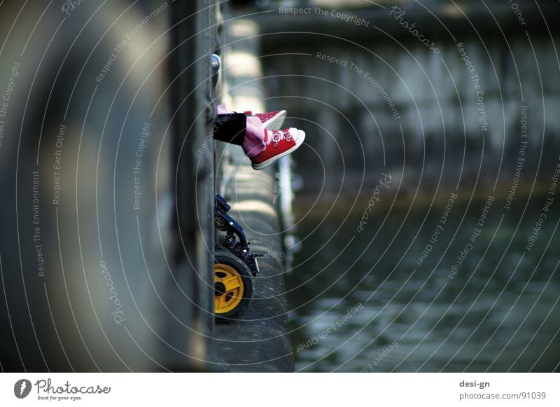 a day in april Footwear Baby carriage Toddler Water Feet Childrens shoe Edge Jetty Harbour Wall (barrier) Children's foot Detail Section of image