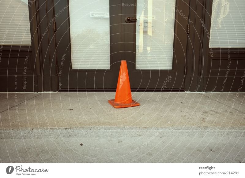 little hat Town Port City Downtown Deserted Manmade structures Building Architecture Door Stand Hat Road sign Warning label Colour photo Exterior shot Detail