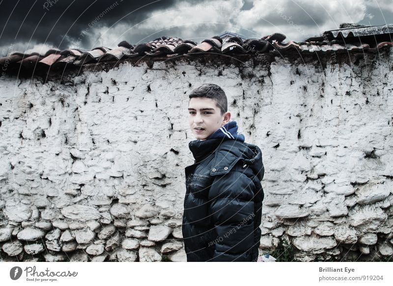 Boy in front of white clay wall Child Boy (child) Infancy 1 Human being 8 - 13 years Elements Bad weather Wall (barrier) Wall (building) Stone Brick Freeze