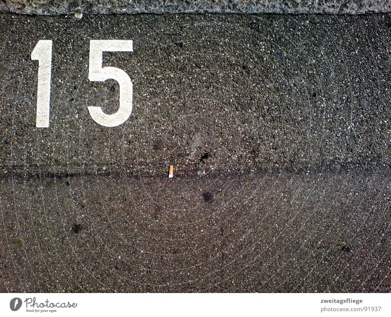 asphalt whispering Asphalt Tar Digits and numbers 15 Cigarette Sidewalk Parking Parking lot Parking space number Chewing gum Traffic infrastructure