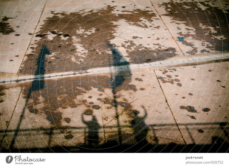 Greetings from the ground Flag Concrete Shadow play Stand Free Brown Happiness Enthusiasm Friendship Inspiration Damp Salutation Overview Ground Post-war period