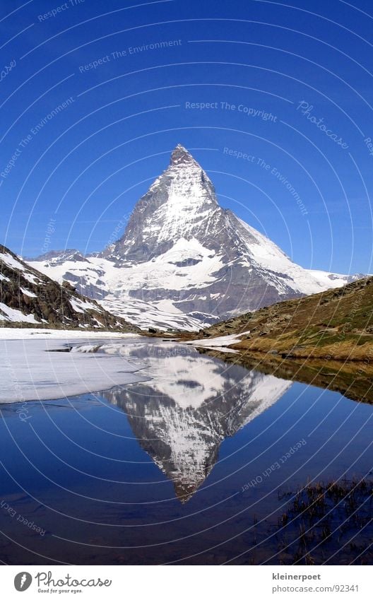 matte horn Lake Mirror Mountain Landscape Americas Nature Blue sky Snow Ice