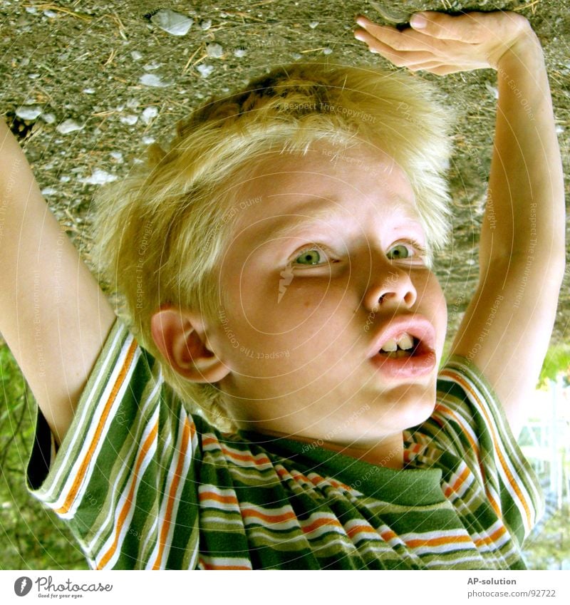 Handstand *1 Boy (child) Child Blonde Facial expression Emotions Fingers T-shirt Striped Eyebrow Lips Freckles Small Leisure and hobbies Vacation & Travel