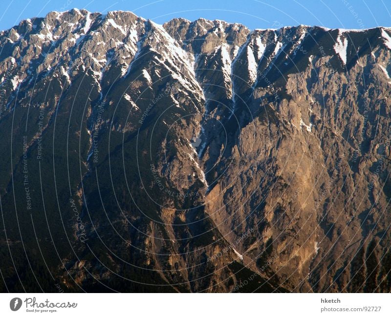 Echo of the mountain call Winter Mountain range Snow layer Sunbeam Alpine Peak cross Hiking Air Alpine hut Hiking boots Horizon Austria Snow melt Perpetual ice