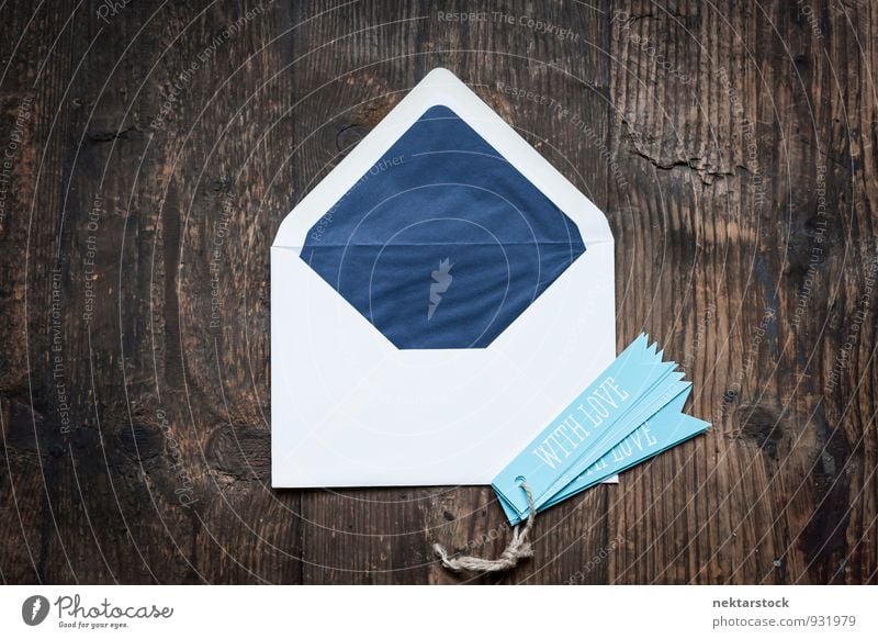 White envelope on wooden chest with blue pendants Design Valentine's Day Mother's Day Birthday Business Musical notes Stationery Paper Piece of paper Love