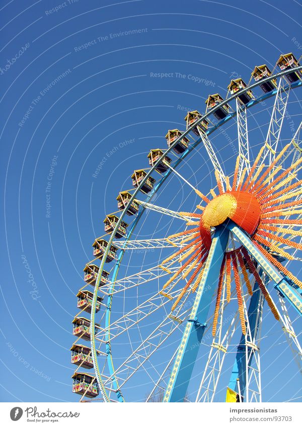 around and around Fairs & Carnivals Ferris wheel Hamburg Dom Yellow Thrill Leisure and hobbies Joy Playing Blue Orange Sky