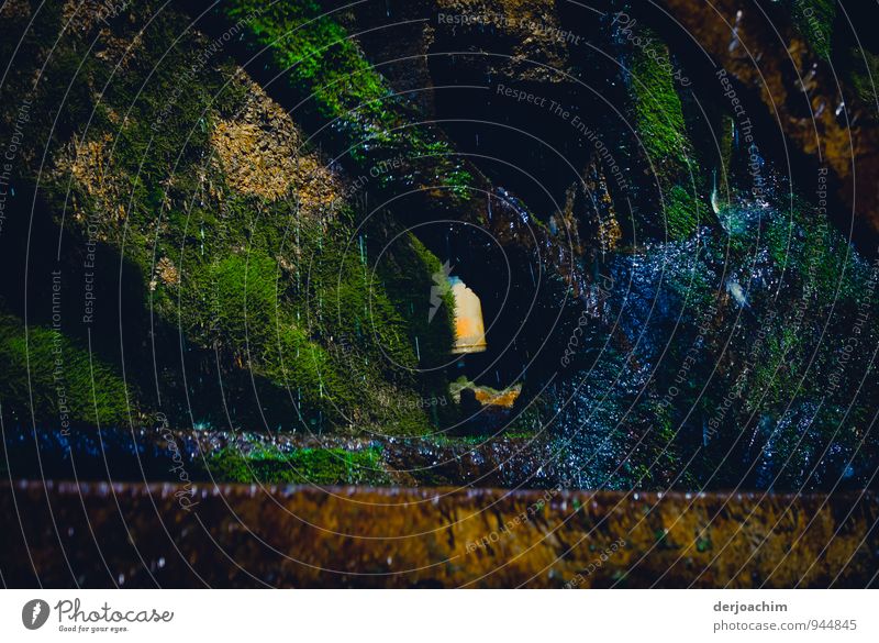 Mill wheel - hub, iron hub of an old mill wheel. Covered with moss. Heroldsmühle district Bamberg in the dry valley.7,20 diameter. Largest iron mill wheel in Germany.