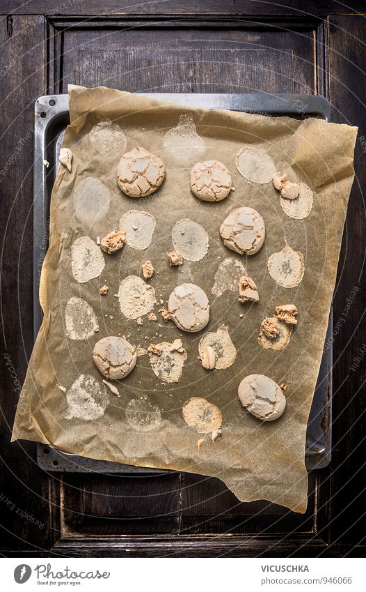 Cookies with cracks on baking paper and old baking tray. Food Dough Baked goods Dessert Nutrition To have a coffee Organic produce Vegetarian diet Diet