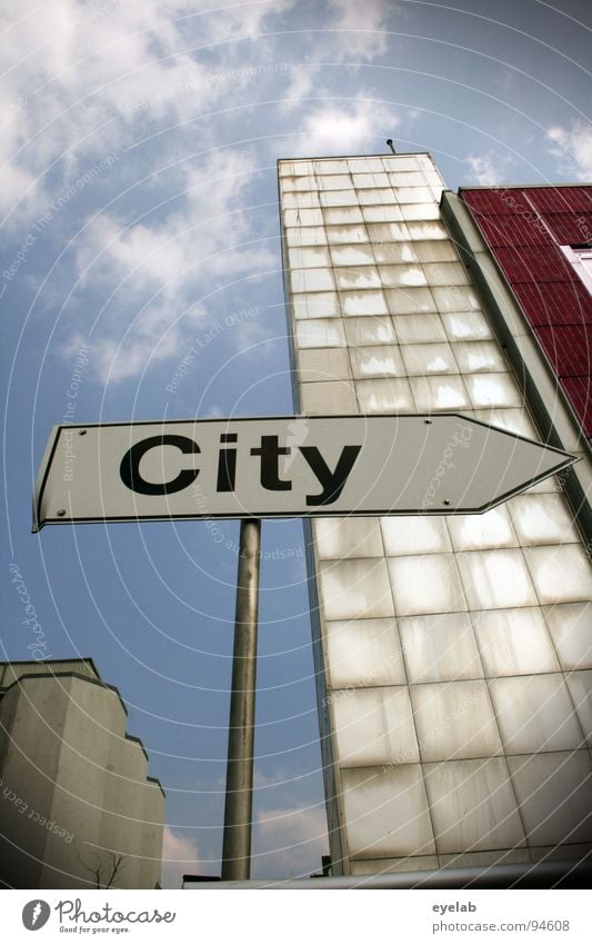 Title (see photo) Town Downtown Direction Typography Building House (Residential Structure) Silo High-rise Red White Steel Concrete Gray Clouds Road sign