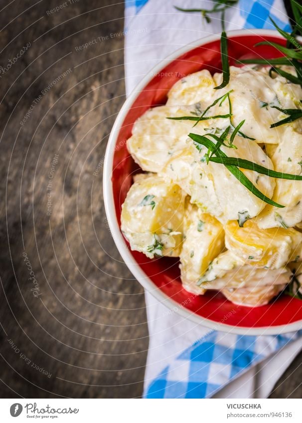 Potato salad with tarragon in a red bowl. Dairy Products Vegetable Lettuce Salad Herbs and spices Nutrition Lunch Dinner Buffet Brunch Banquet Organic produce