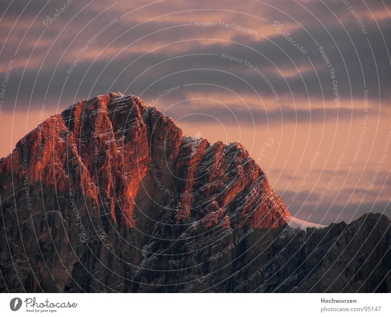 ALPENGLÜHEN Ramsau near Berchtesgaden Peak Red Mountain reed moss alpenglow Climbing Schladming Dachstein Twilight Redness Red hot Steep face Shadow Clouds