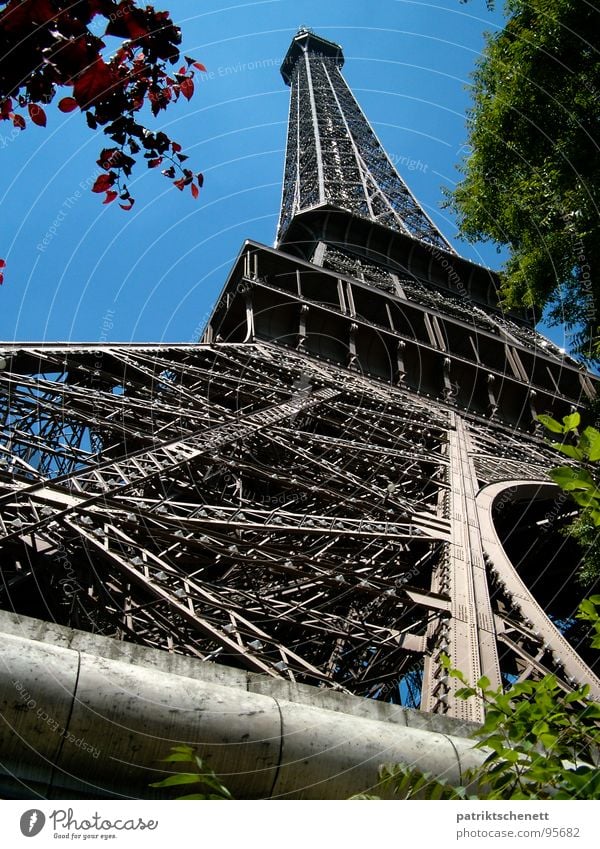 Eiffel Tower Paris Perspective from pedestal to tip France Pedestal Gray Historic Might Towering Landmark Monument Point Metal Blue Sky Gustave Eiffel