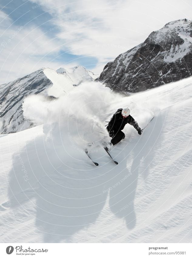 Freeriding on the Kitzsteinhorn Winter Skier Skiing Winter sports Deep snow Hohen Tauern NP White Dangerous Cold Hard Wind Austria Exterior shot Portrait format